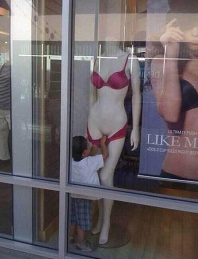 Funny Pictures kid looking mannequin